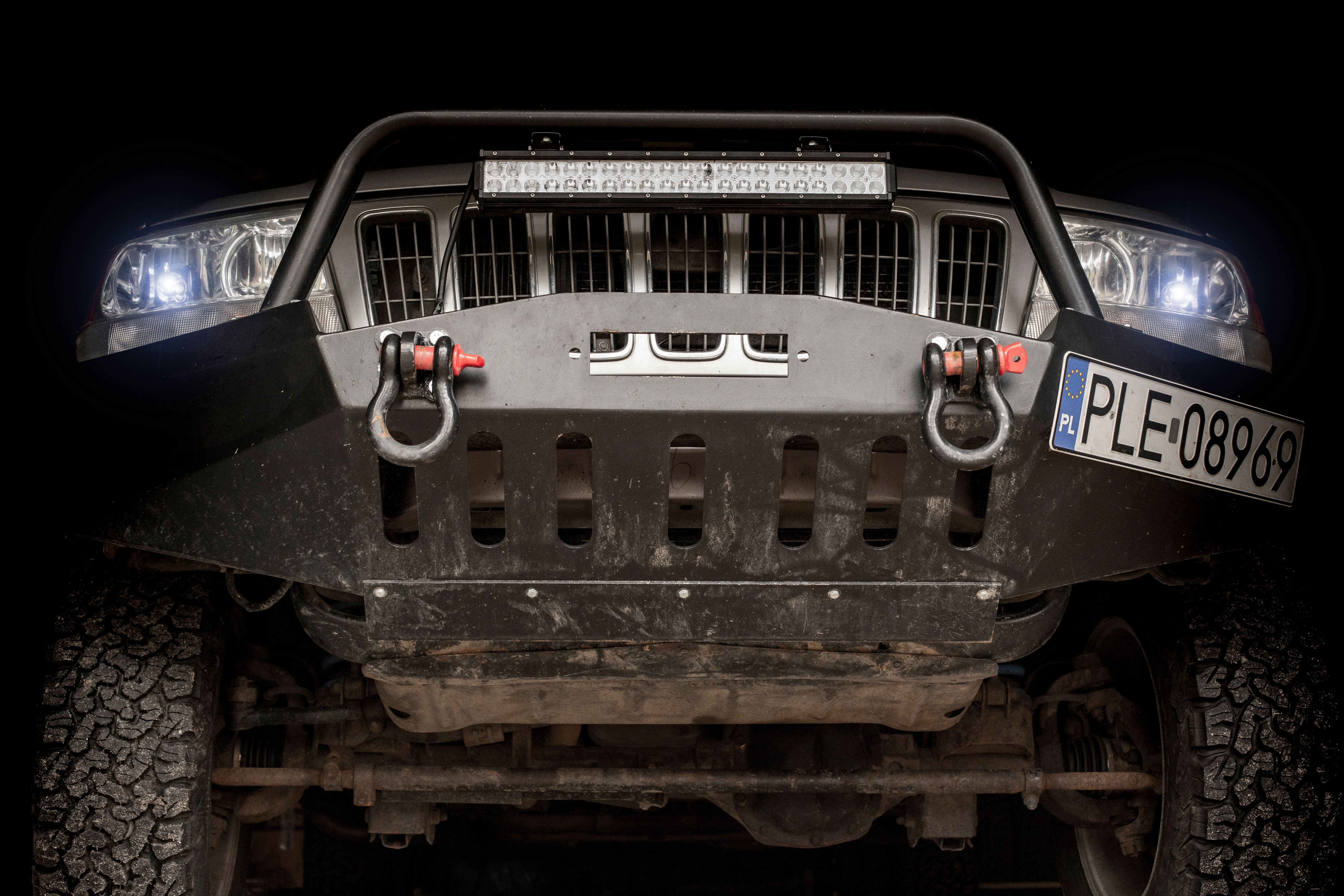 A low-angle view of a vehicle's front bumper