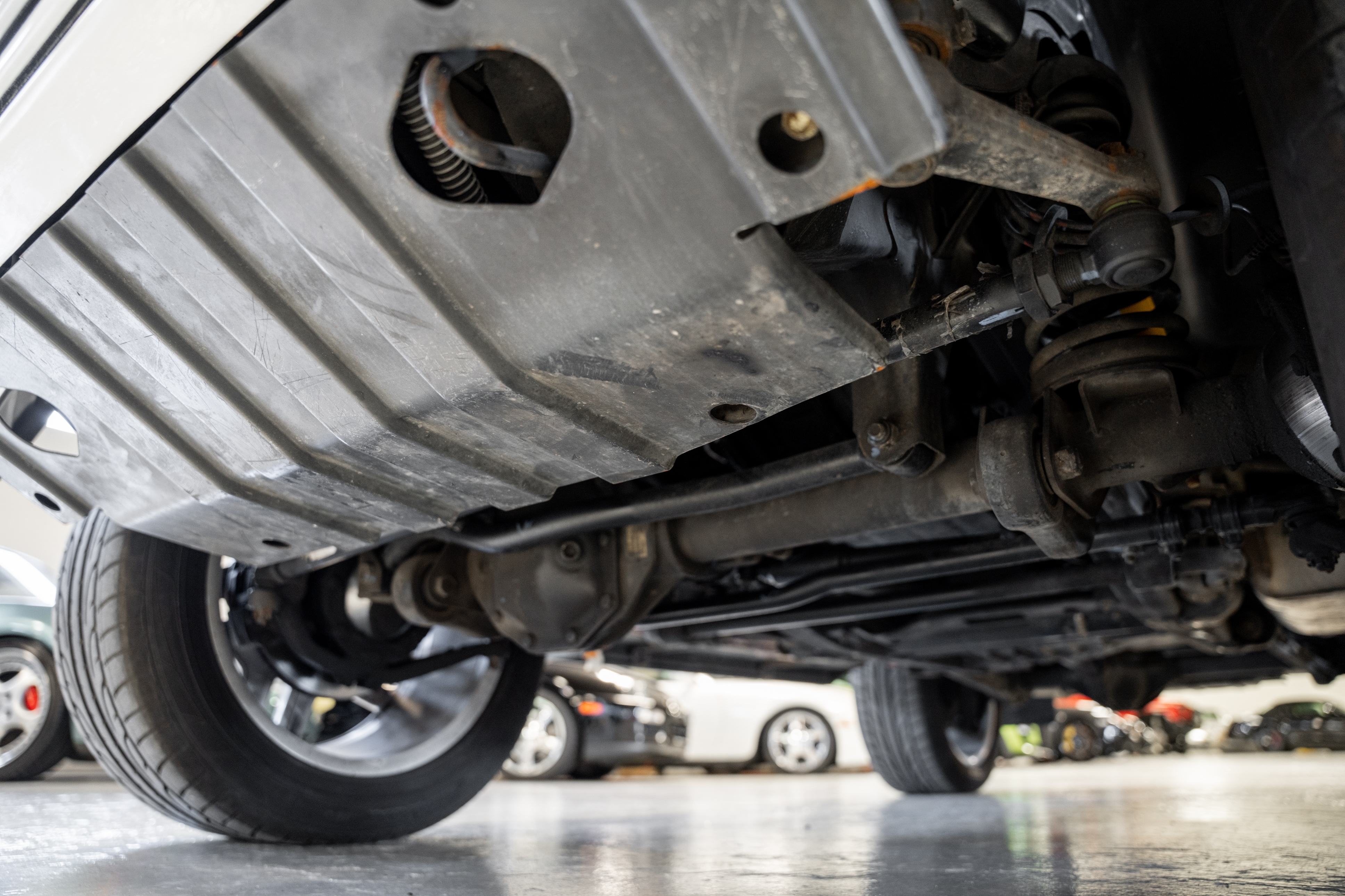 The undercarriage of a vehicle showing off its skid plate.